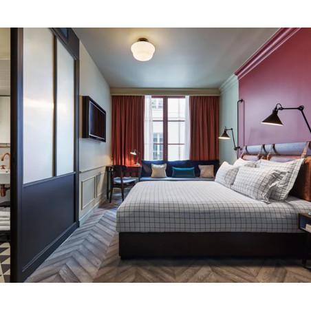 Une chambre dans un appartement parisien avec des corniches C215 au plafond
