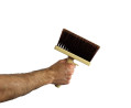 Une personne tenant la brosse rectangulaire monobloc