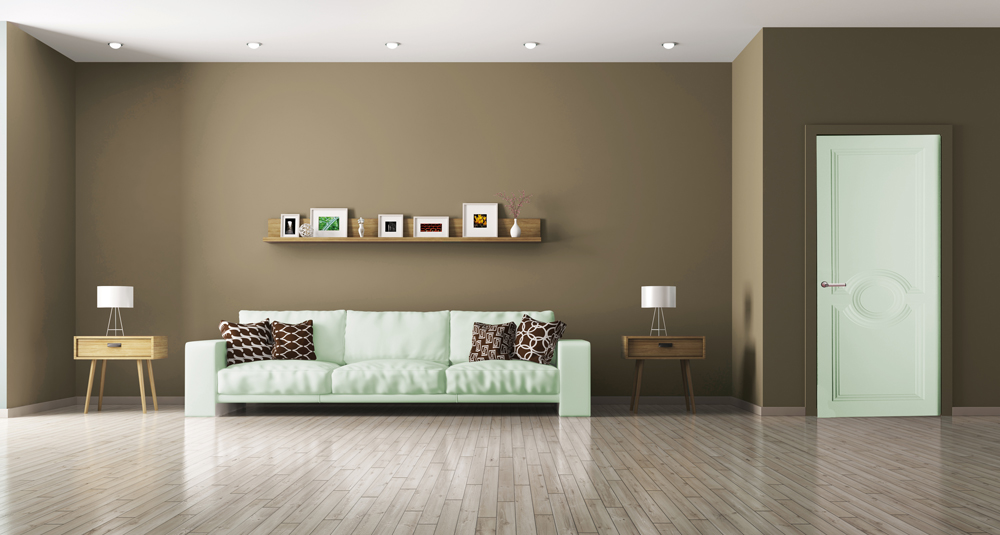 Un grand salon meublé avec une ambiance déco chaleureuse de couleur taupe