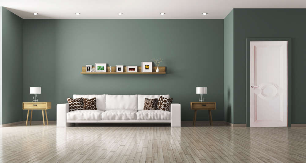 Un grand salon meublé avec une ambiance déco douce et lumineuse avec des couleurs grises et blanches