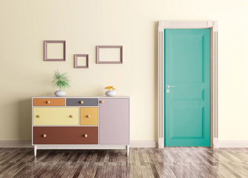 L'entrée d'une pièce comportant un sol avec un parquet, un meuble de plusieurs couleurs et une porte de couleur vert d'eau